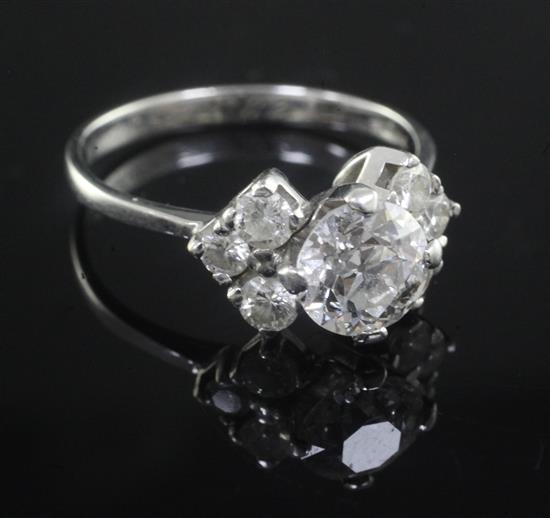 An 18ct white gold and single stone diamond ring with diamond set shoulders, size Q.